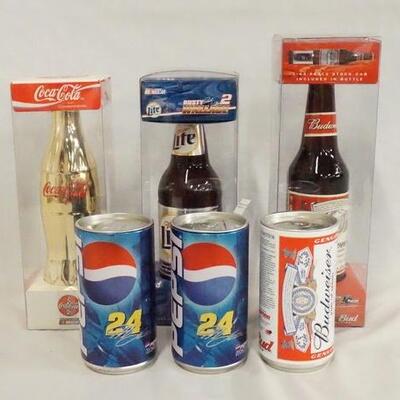 1076	LOT OF SIX NASCAR 1:64 SCALE MODEL CARS IN BEER/SODA CANS/BOTTLES. 
