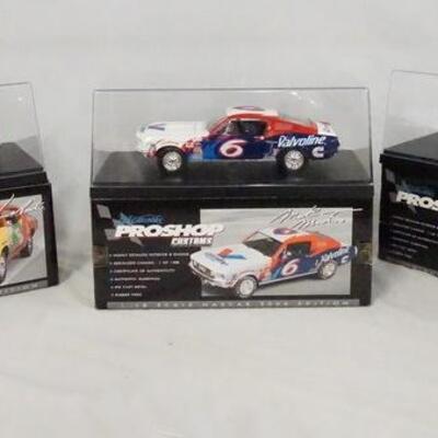 1141	LOT OF THREE 1:18 SCALE NASCAR MODEL CARS W/ DISPLAY CASES & ORIGINAL BOXES.
