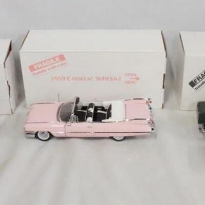 1150	LOT OF THREE DIE CAST 1:24 SCALE CADILLAC MODELS FROM THE DANBURY MINT. LOT INCLUDES; 1959 CADILLAC SERIES 62, 1941 CADILLAC...