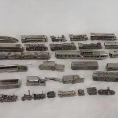 1136	LARGE LOT OF PEWTER TRAINS/RELATED MODELS FROM THE FRANKLIN MINT. MODELS ARE DATES 88 & 85.
