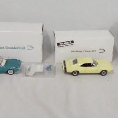 1152	LOT OF FOUR DIE CAST 1:24 SCALE MODEL CARS FROM THE DANBURY MINT. LOT INCLUDES; 1968 CHEVROLET CHEVELE SS-396, 1961 & 1956...