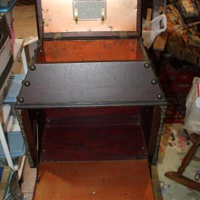lift-top copper-lined humidor, liquor cabinet below.