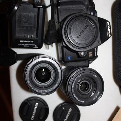 Poloroid Land camera 95; Brownies, Canon Rebel T5 and SL1. Nikon 35mm with five Nikon lenses, Go-Pro kit with accessories