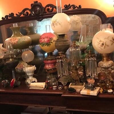 lots of oil lamps, electrified oil lamps, electric table lamps, floor lamps, salvaged iron wall sconces, 