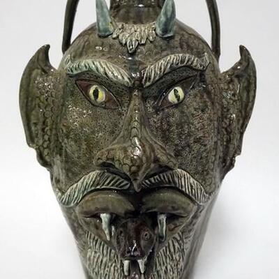 1161	ALBERT HODGE GROTESQUE FACE JUG,VALE N.C.,DEVIL FACE WITH SANKE COMING OUT OF HIS MOUTH, FACE HAVING SNAKE SKIN SCALE FACE, 14 1/2...