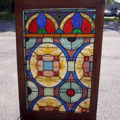 1055	STAINED GLASS WINDOW, 28 IN X 43 1/2 IN
