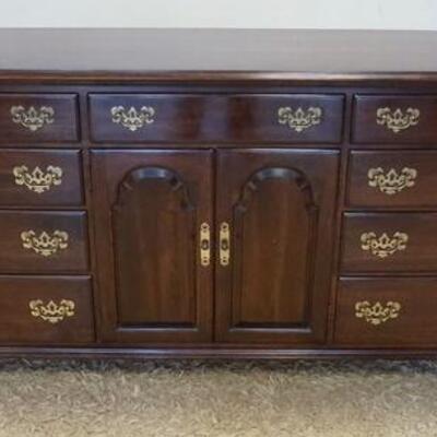 1203	ETHAN ALLEN NINE DRAWER CHERRY CHEST W/ TWO DOORS & TWO CONCEALED DRAWERS. 74 IN W, 20 1/2 IN DEEP, 34 IN H
