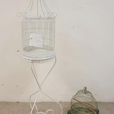 1304	2 BIRD CAGES, ONE ON IRON STAND, CAGE W/STAND IS 56 1/2 IN HIGH
