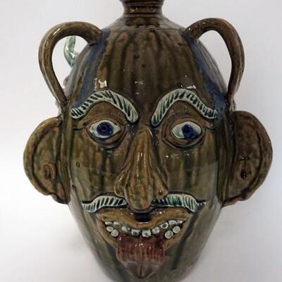 1157	ALBERT HODGE GROTESQUE 3 FACE JUG,VALE N.C., JUG HAS A GREEN AND BLUE DRIP GLAZE, 3 FACES AND 3 HANDLES, SIGNED ON LOWER RIM, 14 1/2...