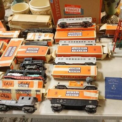 1317	LOT OF LIONELL TRAINS & ACCESSORIES, INCLUDES 2046 LOCOMOTIVE, CAR CARRIER W/CARS, PASSENGER TRAIN, TRACK & RELAYS, ETC
