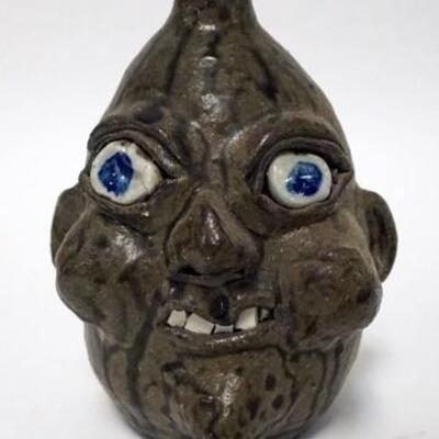 1154	GRACEWELL HEWELL GROTESQUE FACE JUG, UGLY FACE FOLK ART JUG, WITH A TOBACCO SPIT GLAZE. 7 1/2  IN HIGH, SIGNED AND DATED ON BOTTOM...