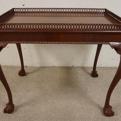 1190	MAHOGANY BALL & CLAW FOOT TABLE W/ PIERCED GALLERY. 34 IN X 22 IN, 28 IN H 
