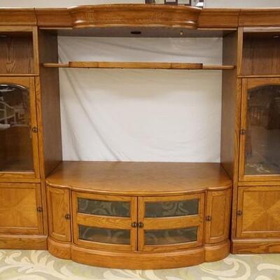 1175	3 PIECE OAK ENTERTAINMENT CENTER FOR FLAT SCREEN TV HAS BEVELED GLASS DOORS 121 1/2 IN W, 71 1/4 IN H
