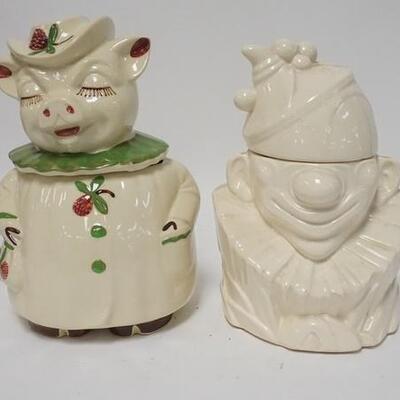 1269	PIG & CLOWN COOKIE JARS	PIG & CLOWN COOKIE JARS. PIG JAR IS MARKED PATENT WINNIE USA, CLOWN IS MARKED MCCOY. TALLEST IS 11 1/2 IN 
