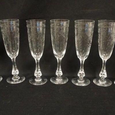 1069	GROUP OF 9 WHEEL CUT CHAMPAGNE FLUTES SIGNED BODA ON BASE, 8 1/2 IN HIGH
