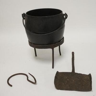 1253	IRON POT W/ STAND, LADLE & HANGING HOOK. THE POT IS 5 1/2 IN H 

