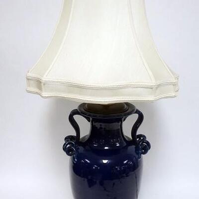 1030	BLUE GLASED POTTERY URN WITH UNUSUAL SCROLLED HANDLES. CRAFTED INTO A TABLE LAMP, 32 IN HIGH
