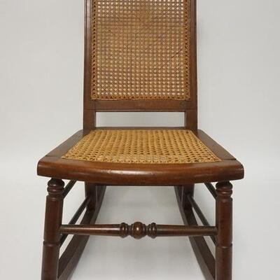 1233	WALNUT VICTORIAN CHILDS ROCKER CANED SEAT & BACK 27 IN H 
