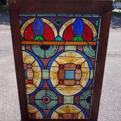 1056	STAINED GLASS WINDOW, 28 IN X 43 1/2 IN
