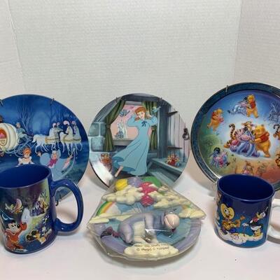 This is a collection of Disney themed plates and mugs. Featuring Cinderella, Winnie The Pooh, Donald Duck and Magic Kingdom characters...