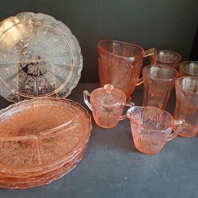 Beautiful set of pink depression glass with cherry blossom design. Includes platter 10.5