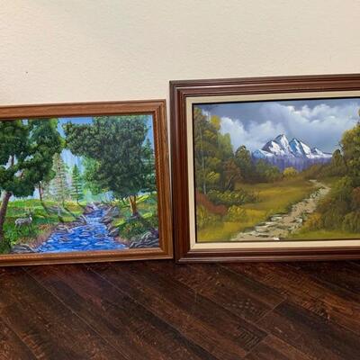 These are 2 paintings themed with nature and landscape. One is done in oil and the other in acrylic paints. The are both nicely framed in...