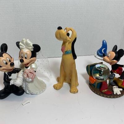 This is a collection of Disney ceramic collectibles featuring Mickey and Minnie dressed for a wedding (bouquet has broken stem but should...