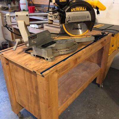 What a setup!  A Dewalt sliding miter saw, a table saw, and a work table that will make your neighbors jealous!  All are in very good...