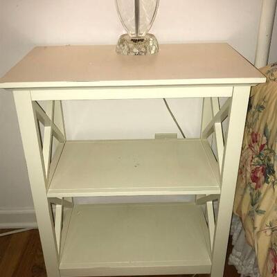 Off-white night stand with two shelves and a criss cross pattern on both sides. Nightstand is in good condition. It measures 14â€ x...