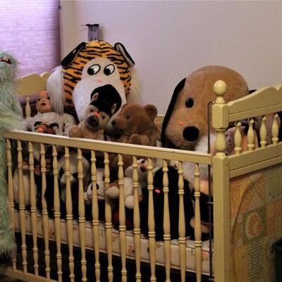 Vintage collectible stuffed animals by the cribful.