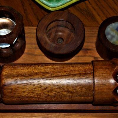 Wooden kaleidoscope with three interchangeable lenses.