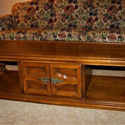 Large,  dark solid oak coffee table has plenty of room for storage and more.  