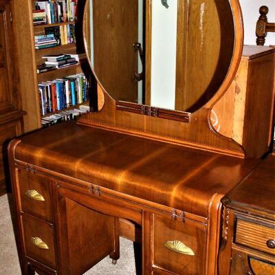 Antique vanity with mirror features lovely art deco styling.