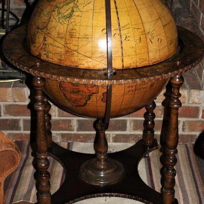 Olde world globe doubles as liquor storage.
