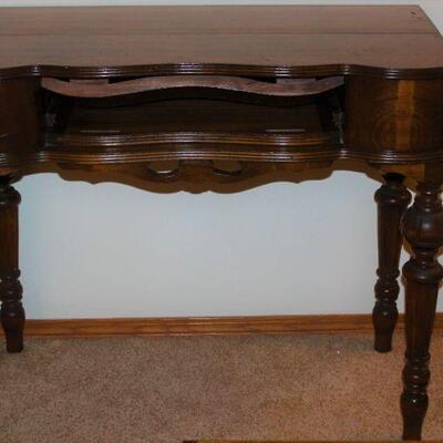 A stately and impressive Victorian flip-top desk with pull out writing surface.  It's distinguished by it's robust legs and ornate...