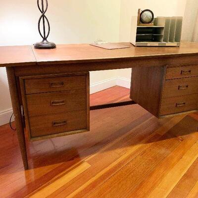 Fabulous Fifties solid walnut and walnut veneer desk. Leaf on one side opens up to 72