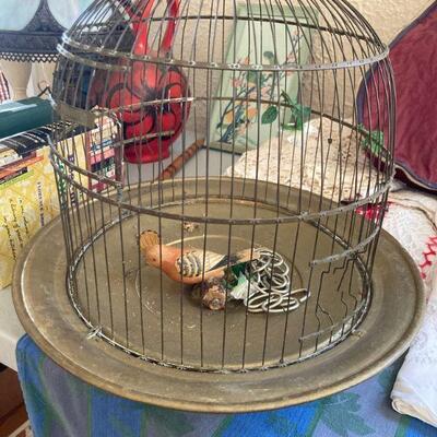 Vintage brass birdcage on pedestal