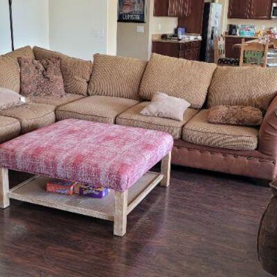Sectional sofa and cushioned center table