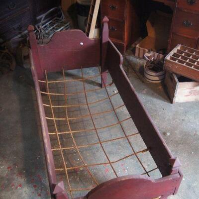 Antique child's bed with original roping.