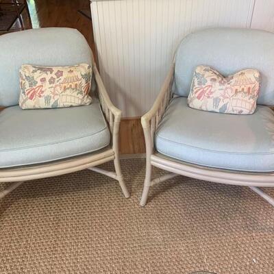 These are matching bamboo chairs featuring a decorative loop pattern throughout the designs on them both. They come with throw pillow and...