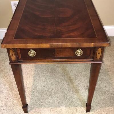 Beautiful wooden side table with gold detailing as well as a drawers. It measures 27â€ x 19â€ x 23â€ and has a drawers width/depth of...