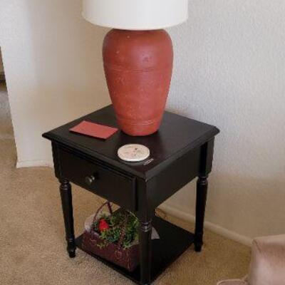 small wood table and decorative lamp