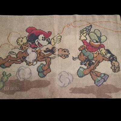 Vintage Walt Disney rug from the early 1940s features Mickey Mouse at the rodeo riding his horse Tanglefoot. Rug has some wear with...