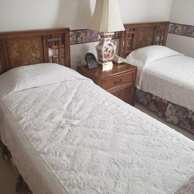 pair of twin beds with wooden headboards, sold separately and a NIGHT STAND