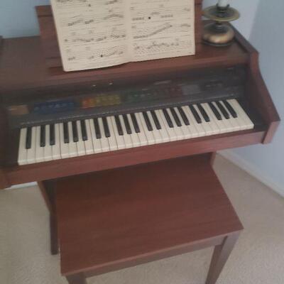 small piano and matching bench