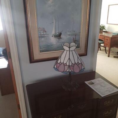 Nice picture, by an artist here in Florida. It is an original painting.   A very nice  tiffany style lamp