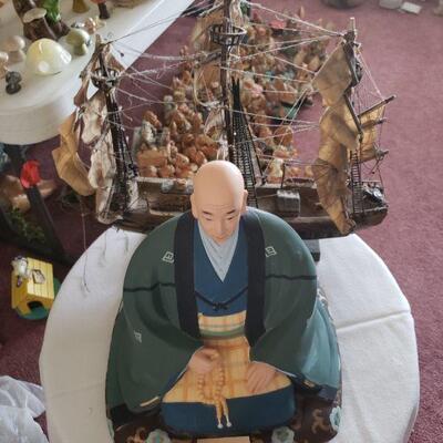 This is a clipper ship and a monk with his beads, sold separately