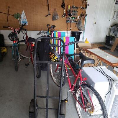 Three bikes and a hand cart