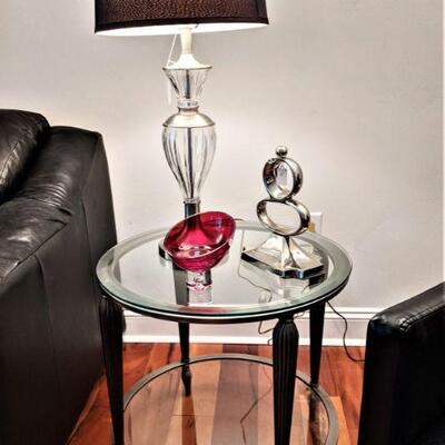 One of a pair of nice glass top round end tables with glass shelf at bottom.  Lamps (pair) glass and brushed nickel with black shades.