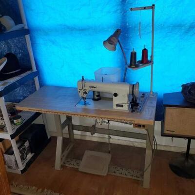 1018	

Brother Sewing Machine And Sewing Table
Table Measures Approx: 48